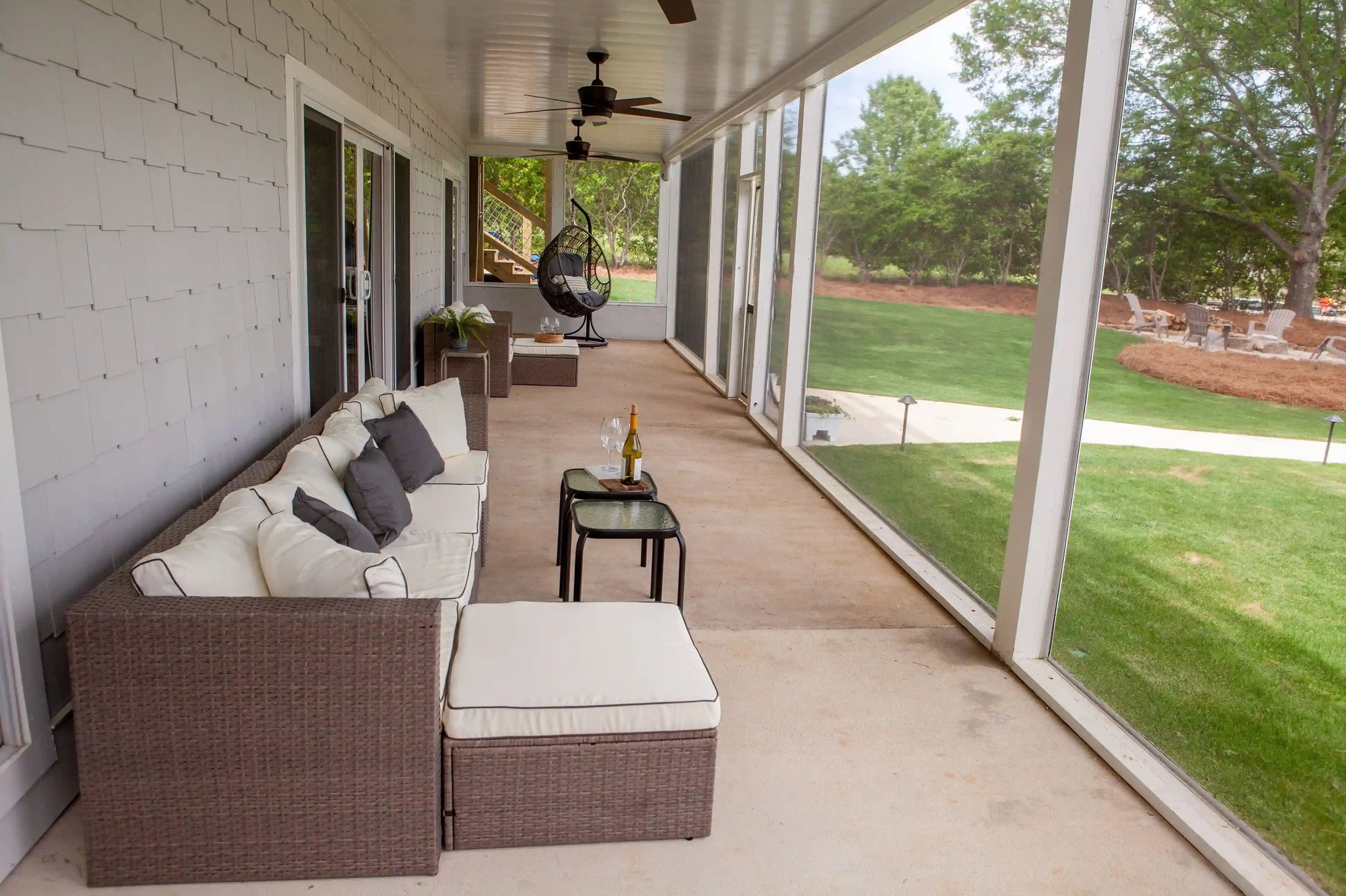 Downstairs Back Porch Overlooking Lakefront Property _ PAXISgroup Custom Home Builders in GA_11zon