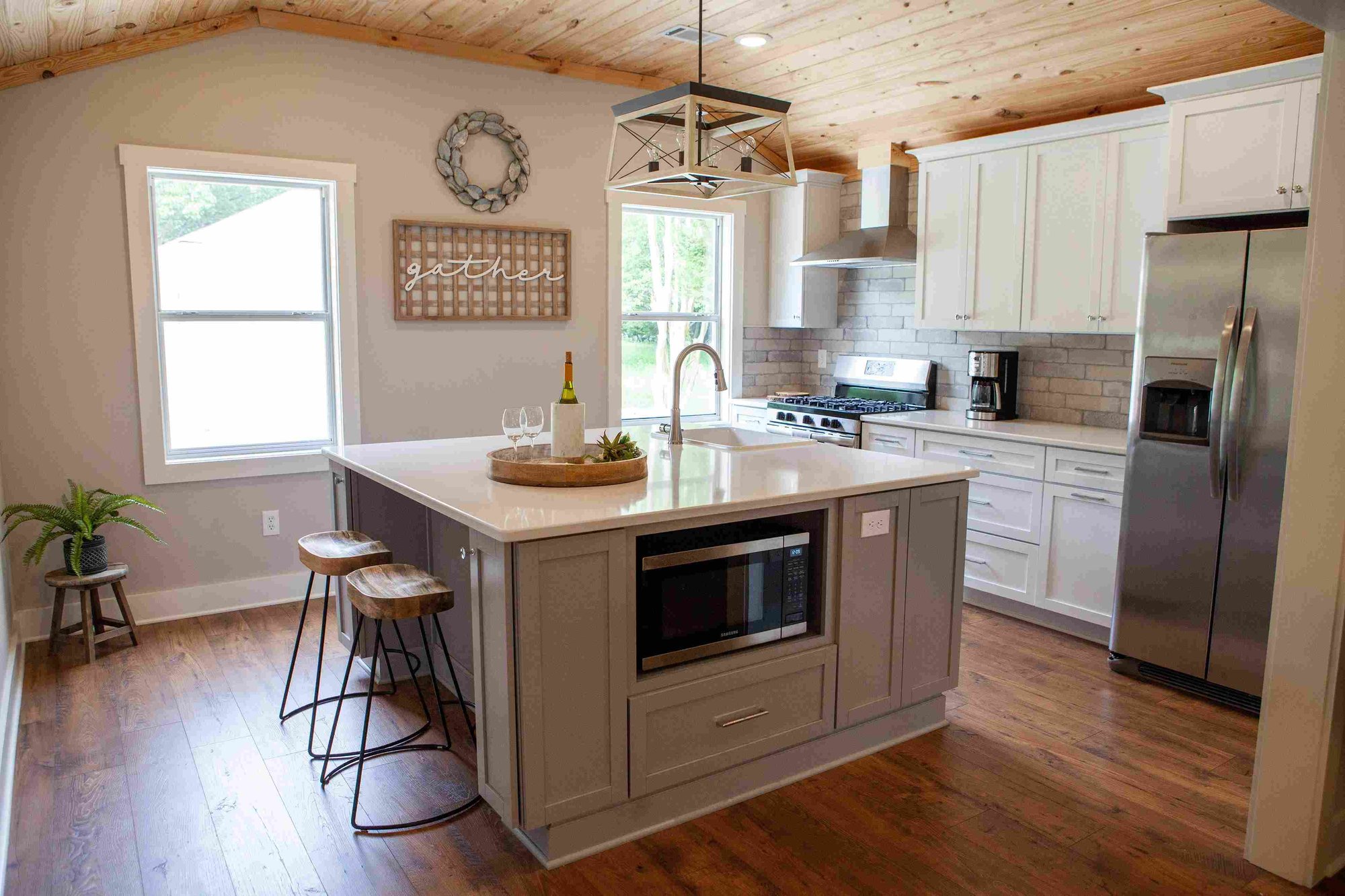 Kitchen Island and Wood Plank Ceiling in Remodeled Home _ PAXISgroup Custom Home Builders in GA_11zon