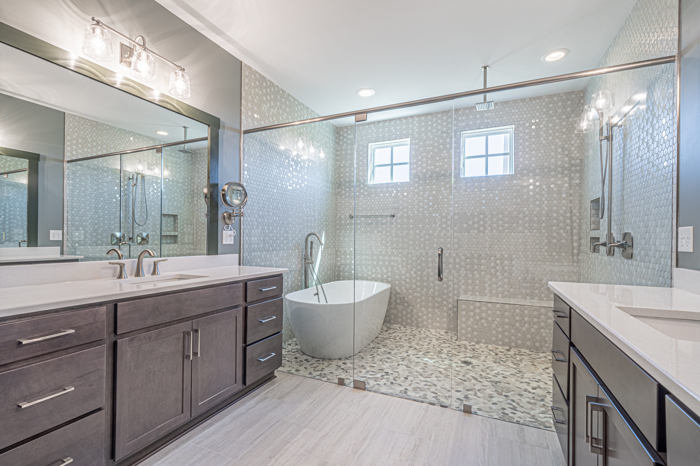 Master Bathroom Vanity with Single Sink and View of Large Walk in Shower and Standing Tub | PAXISgroup