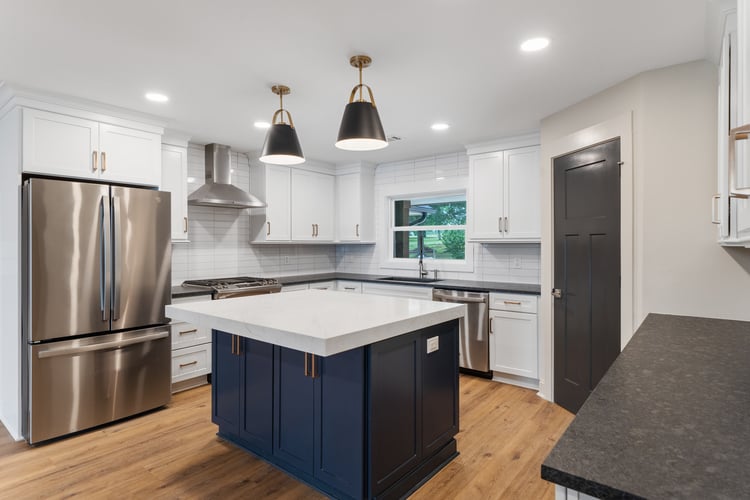 Modern kitchen in custom home remodel by PAXISgroup