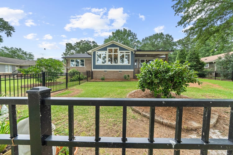 Front yard and exterior of custom home renovation by PAXISgroup